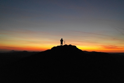 Person silhouetted against the sunrise