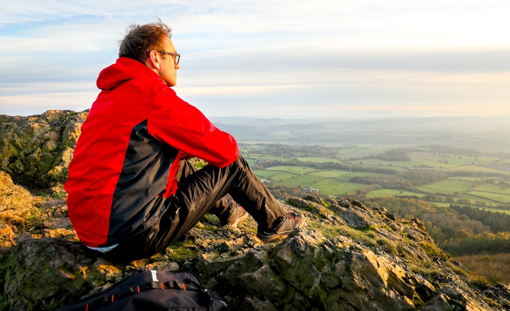 Man sitting at the top of The Wrekin