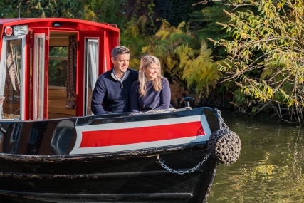 visitors on a narrow boat on the canals