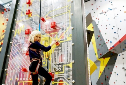 Child rock climbing at Newport Rocks climbing centre